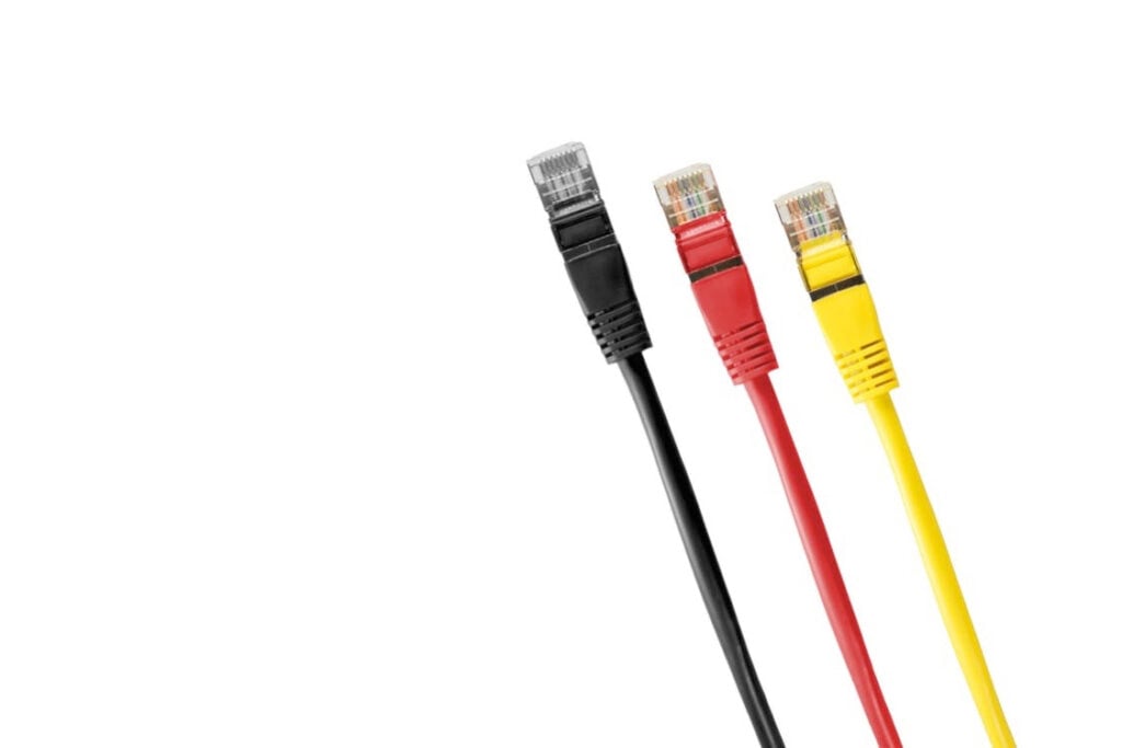 "Black, red, and yellow Ethernet cables with connectors, highlighting internet connectivity and networking solutions."