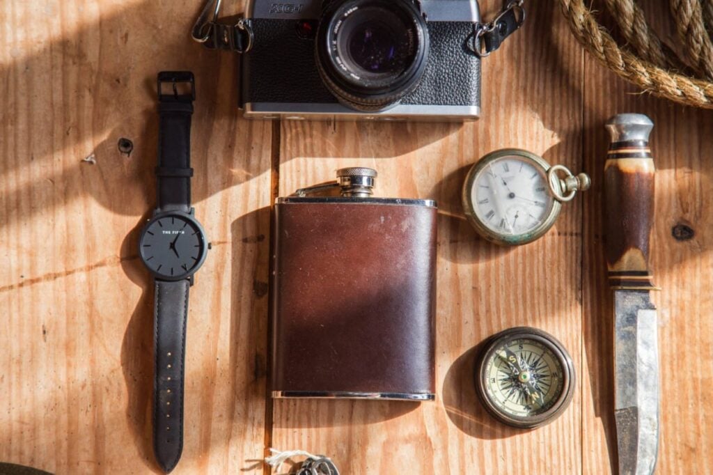 "Assorted vintage items representing tools for creating a webpage using Python and Flask"