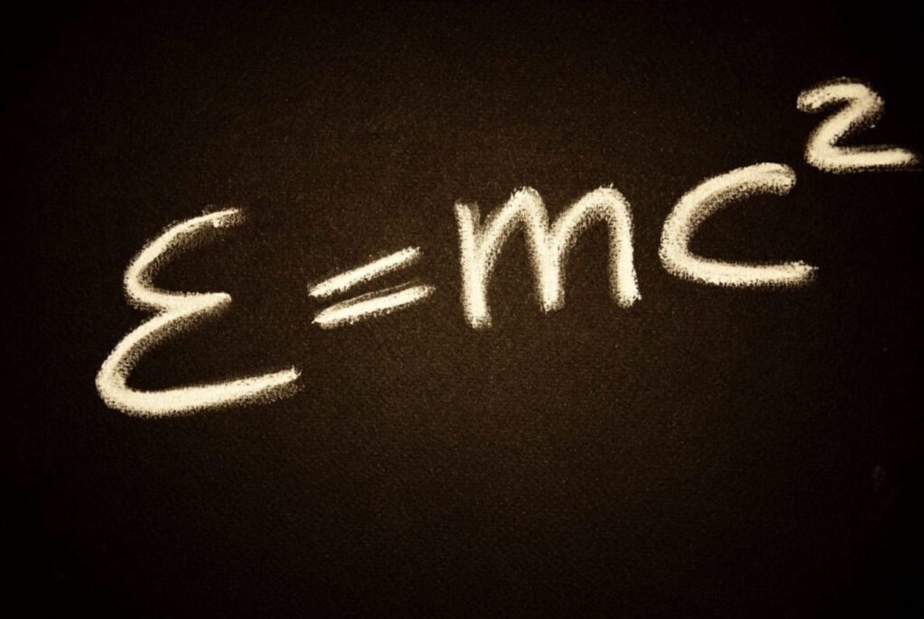 "Einstein's equation E=mc² written in chalk on a blackboard, symbolizing the theory of relativity and physics concepts."