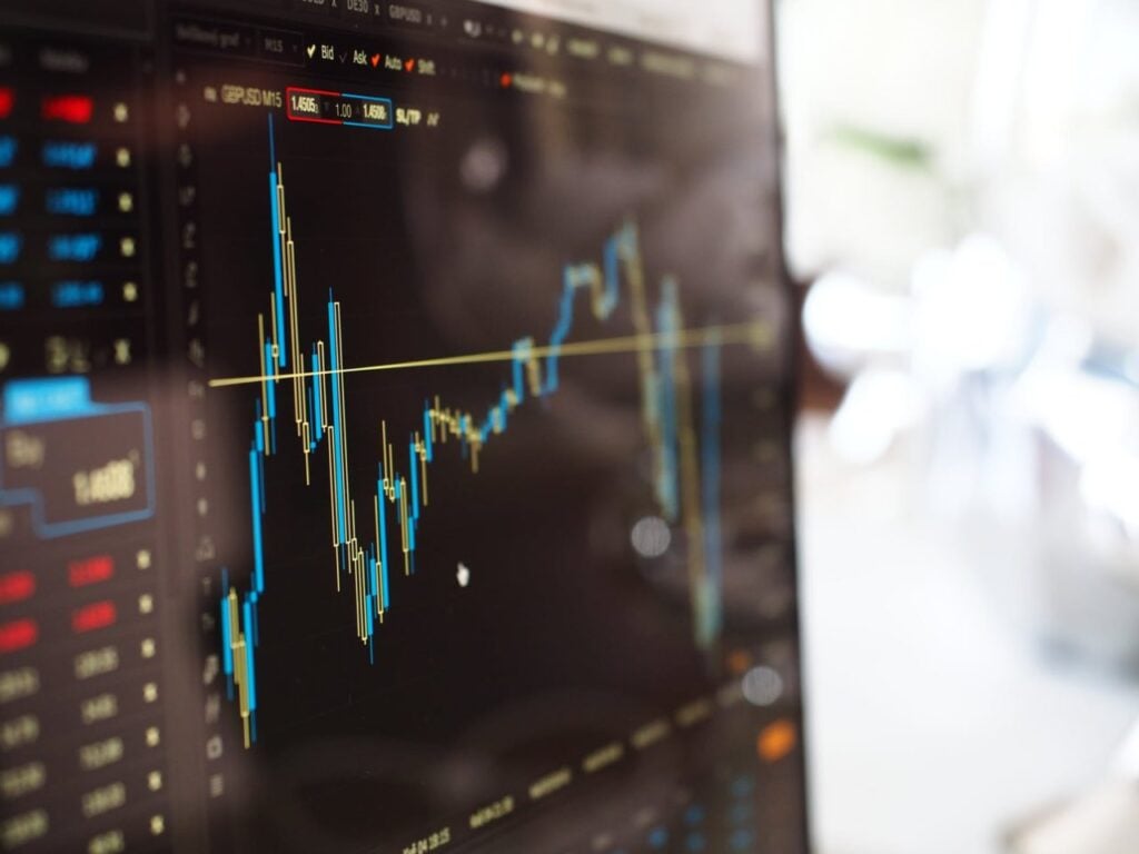 "Close-up of a financial trading screen displaying live currency exchange rate graphs and market data, ideal for finance and stock market analysis."